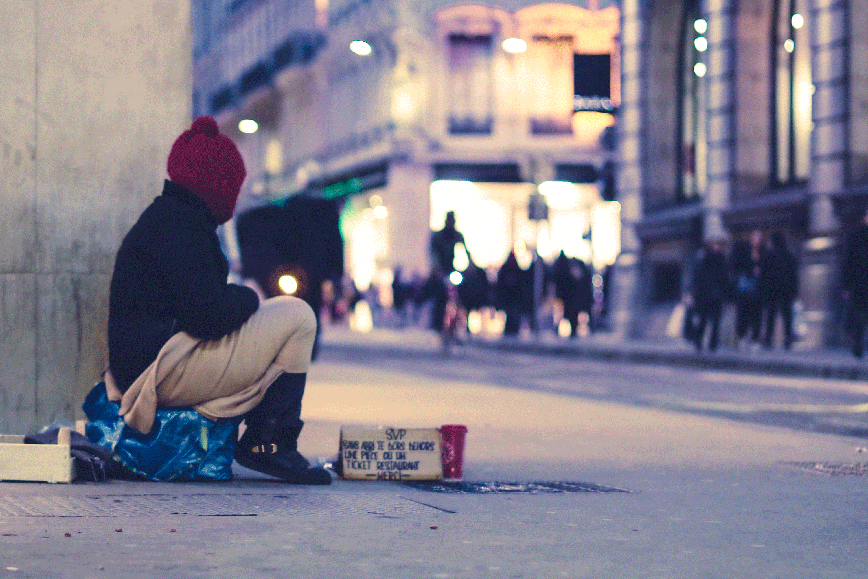 homeless man on busy street