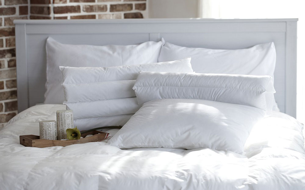 White pillows and tray on bed