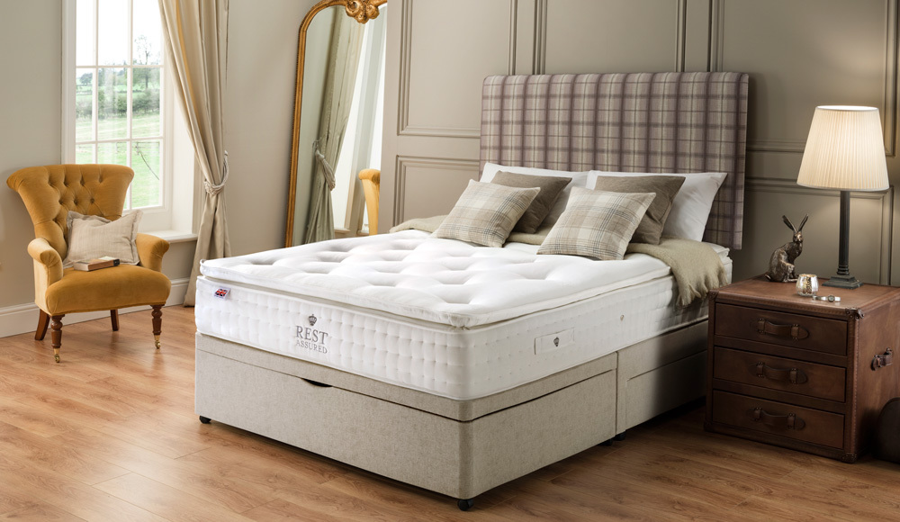 The Rest Assured Knowlton 2000 Pocket Latex Divan Bed with half ottoman storage and two drawers