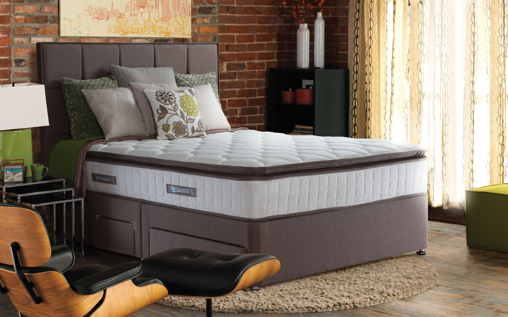 The Sealy Nostromo Posturepedic Pocket 1400 Latex Divan in pewter with four drawers and matching headboard