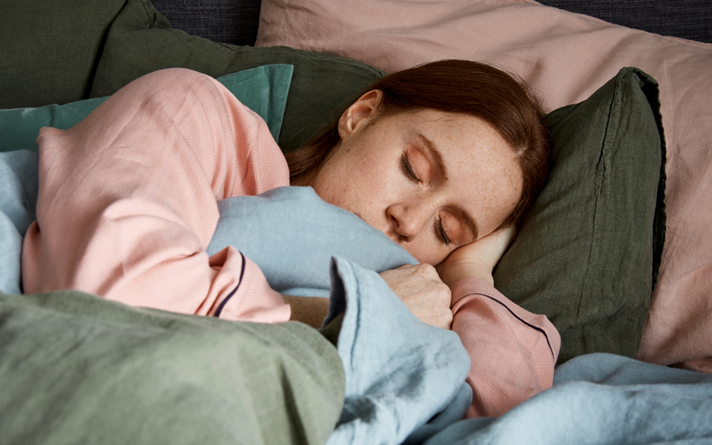 Woman sleeping on pillows