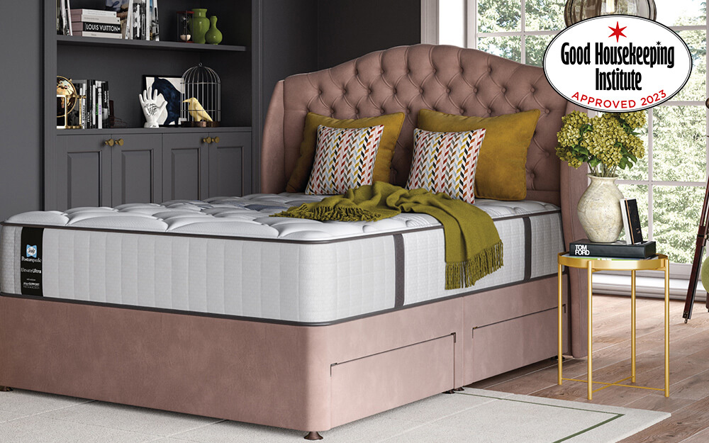 Sealy Posturepedic Elevate Ultra Webber Memory Mattress in a luxury bedroom with grey cabinets and a gold bedside table